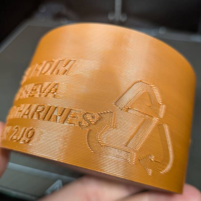 Double-wall single resolution emboss for clamshell packaging