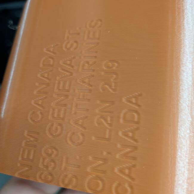 Double-wall fractional resolution emboss for clamshell packaging